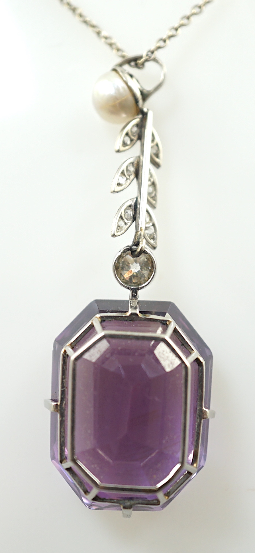 A 1920's white gold, amethyst, diamond and cultured pearl set drop pendant necklace